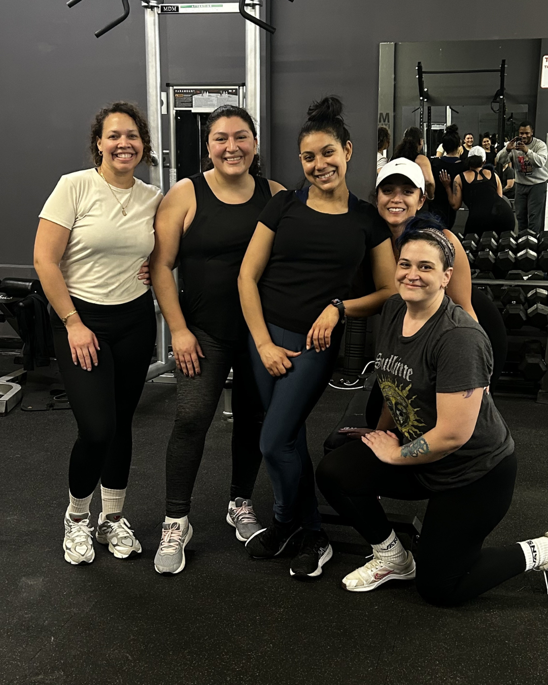 Busy professionals and moms celebrating after a strength training session